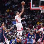 
              Chicago Bulls guard Zach LaVine (8) shoots against the Washington Wizards during the first half of an NBA basketball game in Chicago, Friday, Jan. 7, 2022. (AP Photo/Nam Y. Huh)
            
