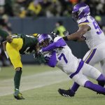 
              Green Bay Packers' Aaron Jones is stopped by Minnesota Vikings' Patrick Peterson during the first half of an NFL football game Sunday, Jan. 2, 2022, in Green Bay, Wis. (AP Photo/Aaron Gash)
            