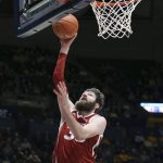 
              Oklahoma forward Tanner Groves shoots during the first half of an NCAA college basketball game against West Virginia in Morgantown, W.Va., Wednesday, Jan. 26, 2022. (AP Photo/Kathleen Batten)
            