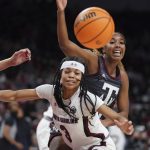 
              Texas A&M guard Kayla Wells, right, and South Carolina guard Destanni Henderson (3) battle for the ball during the first half of an NCAA college basketball game Thursday, Jan. 13, 2022, in Columbia, S.C. (AP Photo/Sean Rayford)
            
