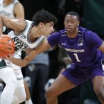 
              Michigan State's Max Christie, left, is defended by Northwestern's Chase Audige during the first half of an NCAA college basketball game, Saturday, Jan. 15, 2022, in East Lansing, Mich. (AP Photo/Al Goldis)
            