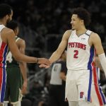 
              Detroit Pistons' Cade Cunningham (2) smiles with Trey Lyles (8) during the second half of an NBA basketball game against the Milwaukee Bucks, Monday, Jan. 3, 2022, in Milwaukee. (AP Photo/Aaron Gash)
            