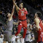 
              Texas Tech guard Adonis Arms attempts a shot past Baylor guard Matthew Mayer during the first half of an NCAA college basketball game Tuesday, Jan. 11, 2022, in Waco, Texas. (AP Photo/Jerry Larson)
            
