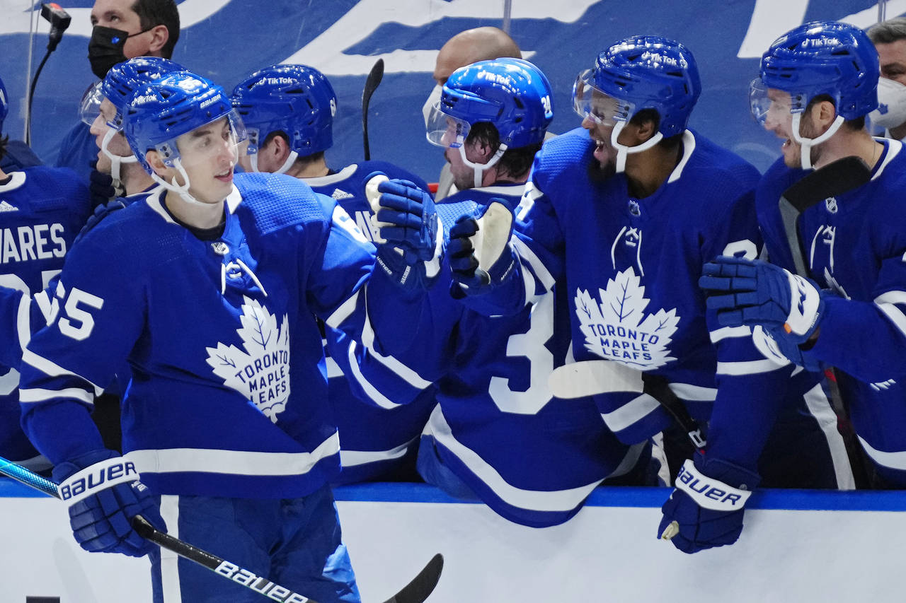Toronto Maple Leafs' Ilya Mikheyev (65) celebrates his goal against the Edmonton Oilers with teamma...