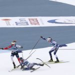 
              FILE - Sweden's Frida Karlsson, center, takes a fall during the WSC Women's Skiathlon 15km cross country event at the FIS Nordic World Ski Championships in Oberstdorf, Germany, Feb. 27, 2021. Climate change is forcing many race organizers to rely on artificial snow for competitions. They use creating a ribbon of white with grass growing along the side. Some skiers and biathletes say machine-made snow is more dangerous and crashes more common because it has a higher moisture content and becomes icy and hard. (AP Photo/Matthias Schrader, File)
            