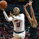 
              Louisville guard Merissah Russell (13) goes in for a layup past Wake Forest guard Alyssa Andrews (0) during the second half of an NCAA college basketball game in Louisville, Ky., Sunday, Jan. 23, 2022. Louisville won 72-60. (AP Photo/Timothy D. Easley)
            