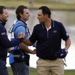
              Lee Hodges, left, shakes hands with Paul Barjon on the ninth hole after they both finished the third round of the American Express golf tournament on the Pete Dye Stadium Course at PGA West on Saturday, Jan. 22, 2022, in La Quinta, Calif. (AP Photo/Marcio Jose Sanchez)
            
