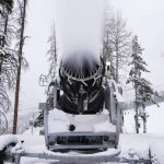 
              A machine blows snow at Vail Mountain Resort, Wednesday, Dec. 29, 2021, in Vail, Colo. Newer snowmaking technology is allowing ski areas to be more efficient with energy and water usage as climate change continues to threaten snowpack levels. (AP Photo/Brittany Peterson)
            