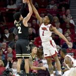 
              Arkansas guard JD Notae (1) blocks the shot of Vanderbilt guard Scotty Pippen Jr. (2) during the first half of an NCAA college basketball game Tuesday, Jan. 4, 2022, in Fayetteville, Ark. (AP Photo/Michael Woods)
            