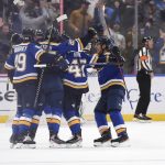 
              St. Louis Blues center Jordan Kyrou (25), center, is congratulated after scoring the winning goal over the Dallas Stars during the third period of an NHL hockey game Sunday, Jan. 9, 2022, in St. Louis. (AP Photo/Joe Puetz)
            