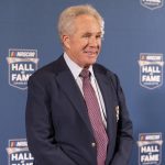 
              NASCAR Hall of Fame member Darrell Waltrip poses for photos prior to the induction ceremony on Friday, Jan. 21, 2022, in Charlotte, N.C. (AP Photo/Matt Kelley)
            