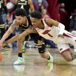 
              Arkansas guard JD Notae (1) and Vanderbilt guard Scotty Pippen Jr. (2) fight for control of the ball during the first half of an NCAA college basketball game Tuesday, Jan. 4, 2022, in Fayetteville, Ark. (AP Photo/Michael Woods)
            
