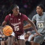 
              South Carolina forward Laeticia Amihere (15) dribbles against Vanderbilt guard Iyana Moore (23) during the first half of an NCAA college basketball game Monday, Jan. 24, 2022, in Columbia, S.C. (AP Photo/Sean Rayford)
            