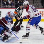 
              Colorado Avalanche goaltender Darcy Kuemper (35) makes a save against Montreal Canadiens center Mike Hoffman (68) during the third period of an NHL hockey game Saturday, Jan. 22, 2022, in Denver. (AP Photo/Jack Dempsey)
            