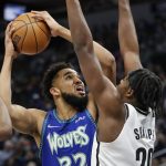 
              Minnesota Timberwolves center Karl-Anthony Towns (32) goes to the basket against Brooklyn Nets center Day'Ron Sharpe (20) in the first quarter of an NBA basketball game Sunday, Jan. 23, 2022, in Minneapolis. (AP Photo/Bruce Kluckhohn)
            