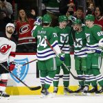
              Carolina Hurricanes' Andrei Svechnikov, third from right, celebrates his goal against the New Jersey Devils with teammates Jaccob Slavin (74), Vincent Trocheck, second right, and Martin Necas (88) during the first period of an NHL hockey game in Raleigh, N.C., Saturday, Jan. 29, 2022. (AP Photo/Karl B DeBlaker)
            