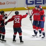 
              Washington Capitals right wing Tom Wilson, right, celebrates his game-winning goal with teammates Dmitry Orlov, from left, Evgeny Kuznetsov and Aliaksei Protas in an overtime period of an NHL hockey game against the Winnipeg Jets, Tuesday, Jan. 18, 2022, in Washington. Washington won 4-3 in overtime. (AP Photo/Patrick Semansky)
            