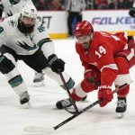
              San Jose Sharks defenseman Brent Burns (88) and Detroit Red Wings center Robby Fabbri (14) battle for the puck in the second period of an NHL hockey game Tuesday, Jan. 4, 2022, in Detroit. (AP Photo/Paul Sancya)
            