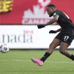 
              Canada's Cyle Larin scores against the United States during the first half of a World Cup soccer qualifier in Hamilton, Ontario, Sunday, Jan. 30, 2022. (Nathan Denette/The Canadian Press via AP)
            