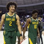 
              Baylor guard Kendall Brown (2) smiles as he, forward Jonathan Tchamwa Tchatchoua, center back, and guard Adam Flagler (10) walk off the floor after an NCAA college basketball game against TCU in Fort Worth, Texas, Saturday, Jan. 8, 2022. (AP Photo/Emil Lippe)
            