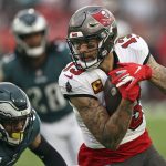 
              Tampa Bay Buccaneers wide receiver Mike Evans (13) pulls in a reception in front of Philadelphia Eagles safety Rodney McLeod (23) during the second half of an NFL wild-card football game Sunday, Jan. 16, 2022, in Tampa, Fla. (AP Photo/Mark LoMoglio)
            
