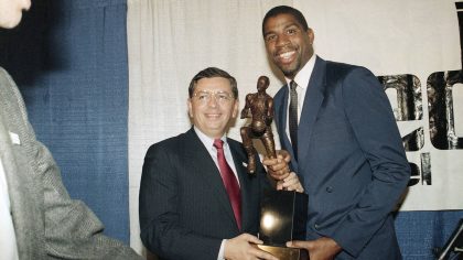 FILE - Earvin "Magic" Johnson breaks stands with David Stern, commissioner of the National Basketba...