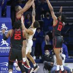 
              Houston's Fabian White, Jr. blocks a shot by Tulsa's Anthony Pritchard during the first half of an NCAA college basketball game in Tulsa, Okla. on Saturday, Jan. 15, 2022. Houston's Josh Carlton, left, and J'Wan Roberts help out on defense. (AP Photo/Dave Crenshaw)
            