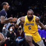 
              Los Angeles Lakers' LeBron James (6) drives past Brooklyn Nets' James Johnson (16) during the first half of an NBA basketball game Tuesday, Jan. 25, 2022 in New York. (AP Photo/Frank Franklin II)
            