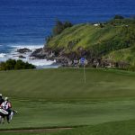 
              Sungjae Im, of South Korea, walks down the 11th fairway with his caddy during the second round of the Tournament of Champions golf event, Friday, Jan. 7, 2022, at Kapalua Plantation Course in Kapalua, Hawaii. (AP Photo/Matt York)
            