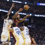 
              Cleveland Cavaliers forward Lamar Stevens (8) passes the ball over Golden State Warriors forward Andrew Wiggins (22), forward Juan Toscano-Anderson (95) and center Kevon Looney (5) during the first half of an NBA basketball game in San Francisco, Sunday, Jan. 9, 2022. (AP Photo/John Hefti)
            