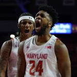 
              Maryland forward Donta Scott (24) and forward Julian Reese react after Scott scored a basket against Illinois during the second half of an NCAA college basketball game, Friday, Jan. 21, 2022, in College Park, Md. Maryland won 81-65. (AP Photo/Julio Cortez)
            