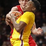 
              Minnesota forward Charlie Daniels (front) competes with Rutgers forward Dean Reiber for a rebound that ends as a jump ball in the second half of an NCAA college basketball game Saturday, Jan. 22, 2022, in Minneapolis. Minnesota won 68-65. (AP Photo/Bruce Kluckhohn)
            