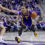 
              LSU guard Xavier Pinson (1) drives to the lane against multiple TCU defenders in the first half of an NCAA college basketball game in Fort Worth, Texas, Saturday, Jan. 29, 2022. (AP Photo/Gareth Patterson)
            