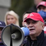 
              Serbia's Novak Djokovic's father Srdjan speaks during a protest in Belgrade, Serbia, Thursday, Jan. 6, 2022. Djokovic's father Srdjan said he was the victim of a "political agenda" in Australia. The Australian government has denied No. 1-ranked Novak Djokovic entry to defend his title in the year's first tennis major and canceled his visa because he failed to meet the requirements for an exemption to the country's COVID-19 vaccination rules. (AP Photo/Darko Vojinovic)
            
