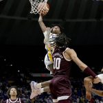 
              Texas A&M forward Ethan Henderson (10) touches the eye of LSU guard Eric Gaines (2) during the first half of an NCAA college basketball game in Baton Rouge, La., Wednesday, Jan. 26, 2022. (AP Photo/Matthew Hinton)
            