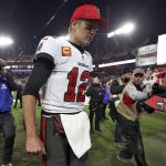 
              Tampa Bay Buccaneers quarterback Tom Brady (12) reacts as he leaves the field after the team lost to the Los Angeles Rams during an NFL divisional round playoff football game Sunday, Jan. 23, 2022, in Tampa, Fla. (AP Photo/Mark LoMoglio)
            