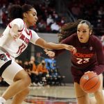 
              Virginia Tech's Kayana Traylor (23) tries to drive the ball around North Carolina State's Jakia Brown-Turner (11) during the first half of an NCAA college basketball game, Sunday, Jan. 23, 2022, in Raleigh, N.C. (AP Photo/Karl B. DeBlaker)
            