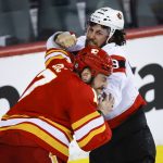
              Ottawa Senators' Scott Sabourin, right, fights with Calgary Flames' Milan Lucic during second-period NHL hockey game action in Calgary, Alberta, Thursday, Jan. 13, 2022. (Jeff McIntosh/The Canadian Press via AP)
            