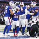 
              Atlanta Falcons cornerback Darren Hall (34) looks on as Buffalo Bills' Devin Singletary (26) celebrates with teammates after scoring a touchdown during the second half of an NFL football game Sunday, Jan. 2, 2022, in Orchard Park, N.Y. (AP Photo/Jeffrey T. Barnes)
            
