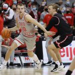 
              Ohio State's Justin Ahrens, left, dribbles past IUPUI's Nathan McClure during the second half of an NCAA college basketball game Tuesday, Jan. 18, 2022, in Columbus, Ohio. (AP Photo/Jay LaPrete)
            