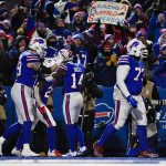 
              Buffalo Bills running back Devin Singletary, second from left, celebrates his touchdown with his teammates during the first half of an NFL wild-card playoff football game against the New England Patriots, Saturday, Jan. 15, 2022, in Orchard Park, N.Y. (AP Photo/Adrian Kraus)
            