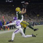
              Green Bay Packers' Allen Lazard catches a touchdown pass over Minnesota Vikings' Kris Boyd during the first half of an NFL football game Sunday, Jan. 2, 2022, in Green Bay, Wis. (AP Photo/Aaron Gash)
            