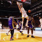 
              Tennessee forward Uros Plavsic (33) dunks the ball over LSU forward Tari Eason (13) during the first half of an NCAA college basketball game Saturday, Jan. 22, 2022, in Knoxville, Tenn. (AP Photo/Wade Payne)
            