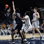 
              Connecticut guard Tyrese Martin (4) shoots over the defense of Butler in the second half of an NCAA college basketball game in Indianapolis, Thursday, Jan. 20, 2022. (AP Photo/AJ Mast)
            