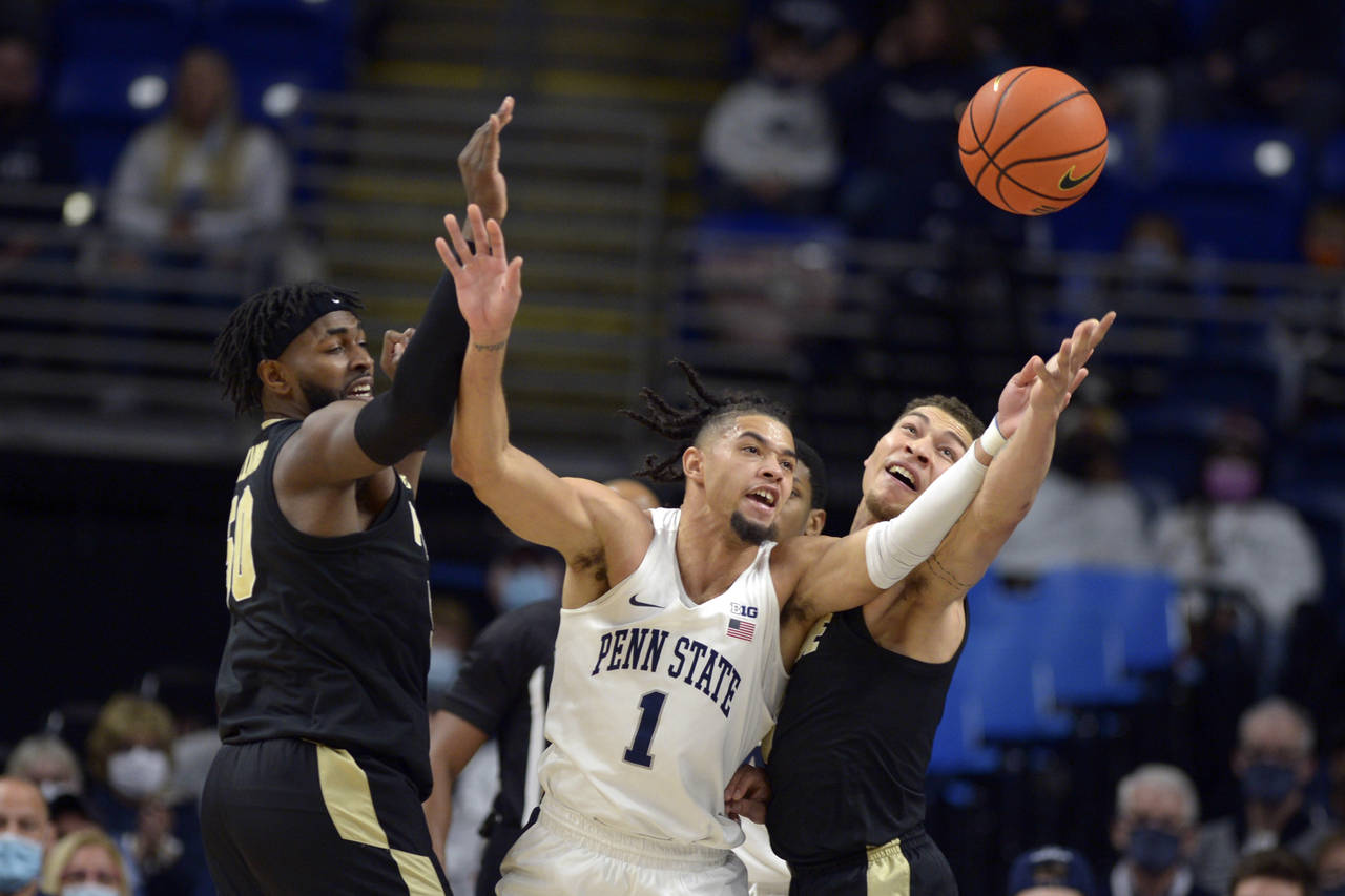 Purdue's Trevion Williams (50), Penn State's Seth Lundy (1) and Purdue's Mason Gillis (0) go for a ...