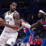 
              Brooklyn Nets center LaMarcus Aldridge, left, is defended by Washington Wizards center Montrezl Harrell during the first half of an NBA basketball game Wednesday, Jan. 19, 2022, in Washington. (AP Photo/Evan Vucci)
            