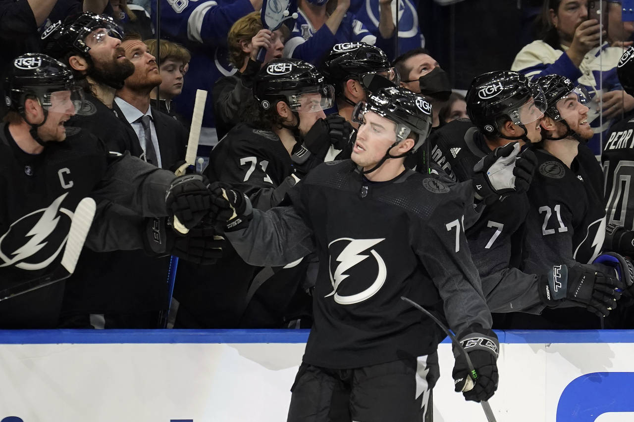 Tampa Bay Lightning center Ross Colton (79) celebrates with the bench after his goal against the Da...
