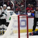 
              San Jose Sharks defenseman Nicolas Meloche, center, celebrates his goal against the Washington Capitals with teammates Matt Nieto, left, and Andrew Cogliano during the second period of an NHL hockey game, Wednesday, Jan. 26, 2022, in Washington. At right is Washington Capitals defenseman Michal Kempny. (AP Photo/Evan Vucci)
            