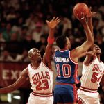 
              FILE - Chicago Bulls teammates Michael Jordan (23) and Horace Grant (54) put double coverage on Detroit Pistons' Dennis Rodman (10) in the second quarter of their Eastern Conference final playoff Game 3 in Chicago, Ill., May 27, 1990. (AP Photo/Jim Mone, File)
            