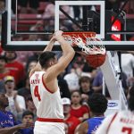 
              Texas Tech's Daniel Batcho (4) dunks the ball during the first half of an NCAA college basketball game against Kansas, Saturday, Jan. 8, 2022, in Lubbock, Texas. (AP Photo/Brad Tollefson)
            